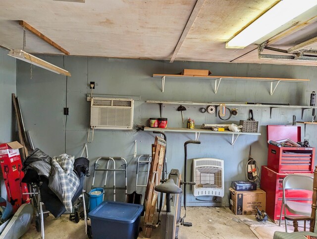 491 NE Dusty Miller Ave, Madison, FL 32340 - garage with heating unit and a wall mounted air conditioner