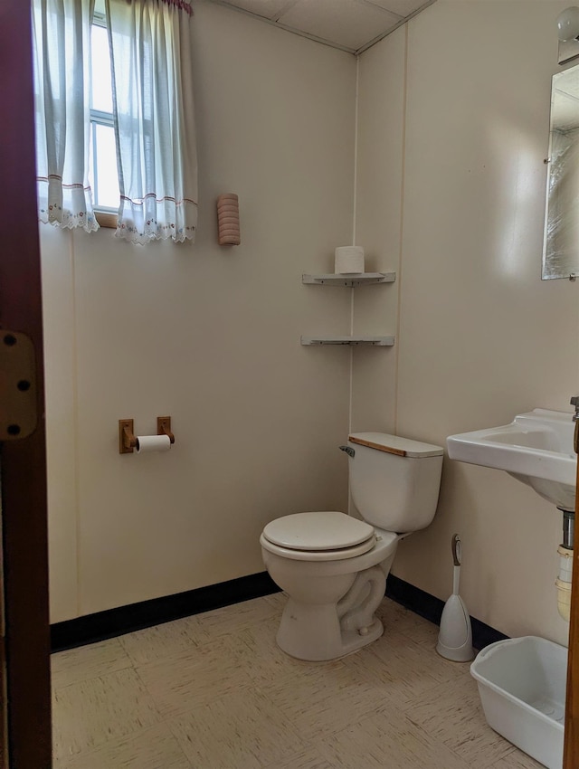 491 NE Dusty Miller Ave, Madison, FL 32340 - half bath featuring toilet and baseboards