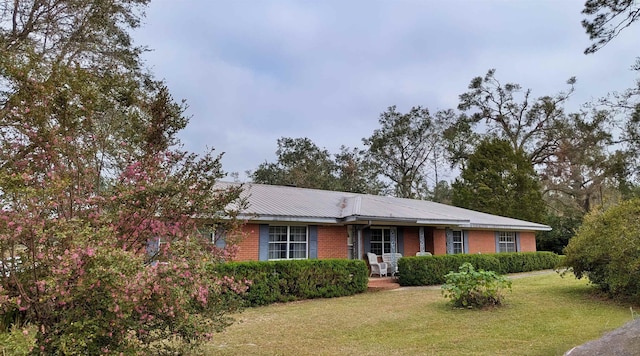 ranch-style home with a front lawn