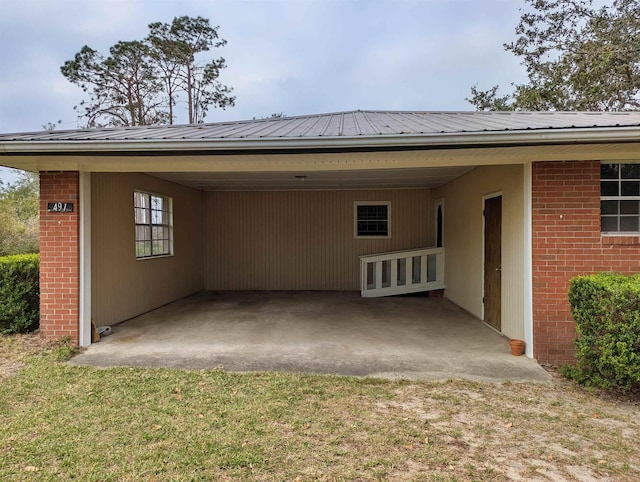 491 NE Dusty Miller Ave, Madison, FL 32340 - view of vehicle parking with a carport