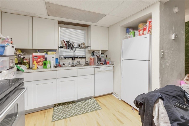1286 Rumba Ln -, Unit Tallahassee, FL 32304 - kitchen featuring white appliances, light wood-style floors, light countertops, white cabinets, and a drop ceiling