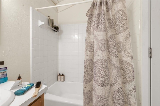 1286 Rumba Ln -, Unit Tallahassee, FL 32304 - bathroom with vanity, shower / tub combo with curtain, and a textured wall