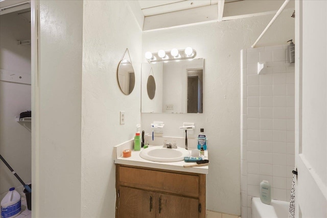 1286 Rumba Ln -, Unit Tallahassee, FL 32304 - bathroom featuring vanity, washtub / shower combination, and a textured wall
