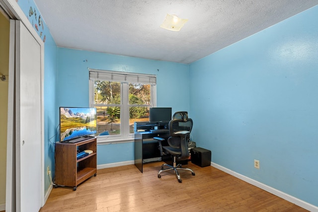 1909 Ermine Ct, Tallahassee, FL 32308 - office area with wood finished floors and a textured ceiling
