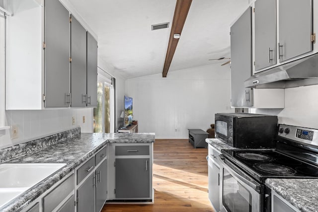 1909 Ermine Ct, Tallahassee, FL 32308 - kitchen with electric range, gray cabinetry, black microwave, under cabinet range hood, and dark wood-style floors