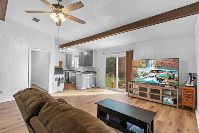 1909 Ermine Ct, Tallahassee, FL 32308 - living room featuring beamed ceiling, light wood-type flooring, and ceiling fan