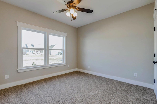 carpeted empty room with ceiling fan