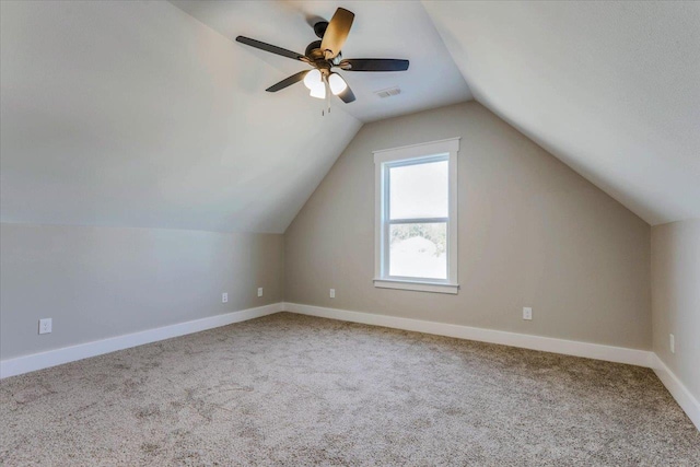 bonus room featuring lofted ceiling, carpet flooring, and ceiling fan