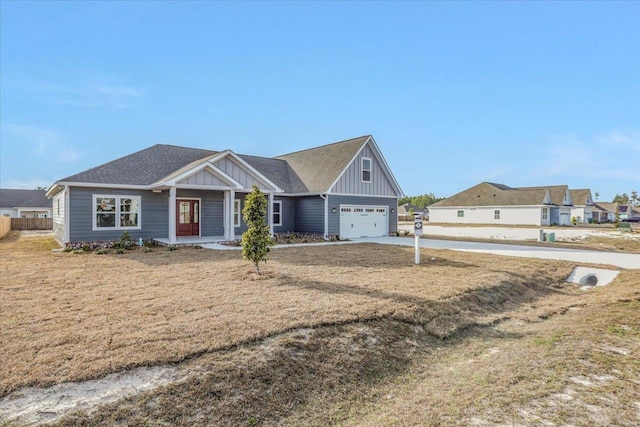 view of front of home with a garage and a front yard