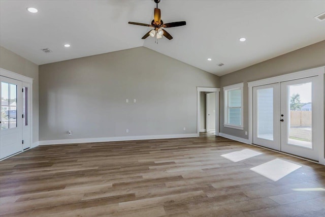 interior space with french doors, a healthy amount of sunlight, and light wood-type flooring