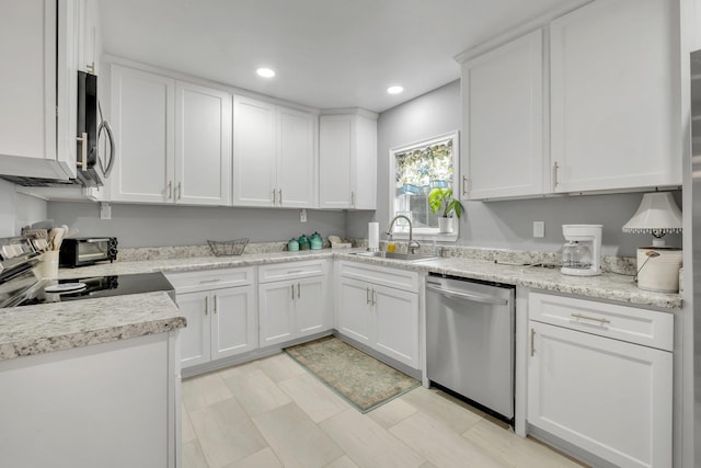 kitchen with white cabinetry, sink, and appliances with stainless steel finishes