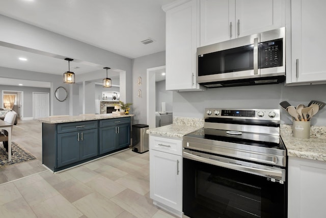 kitchen featuring decorative light fixtures, white cabinetry, stainless steel appliances, and blue cabinets