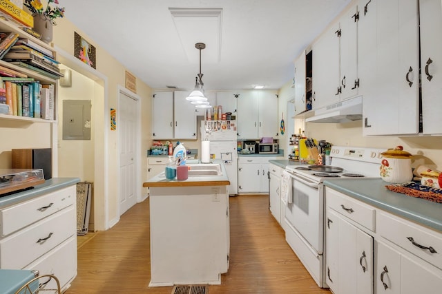 kitchen with white cabinets, hanging light fixtures, and white appliances