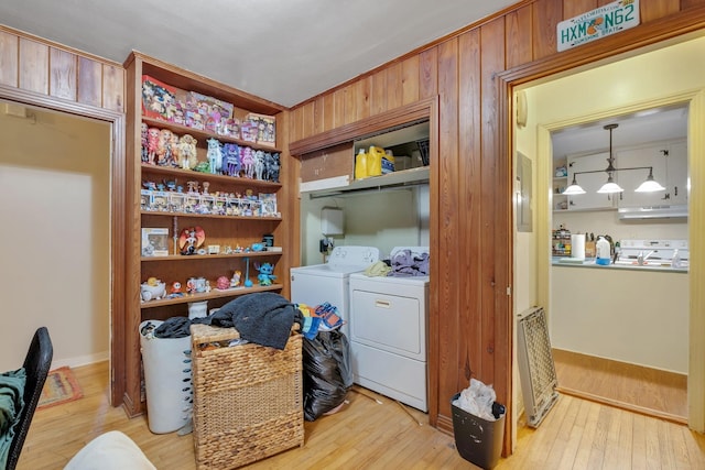 washroom featuring light wood-type flooring and separate washer and dryer