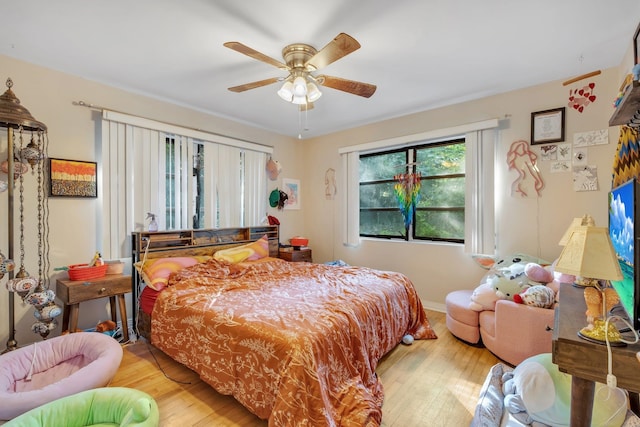 bedroom featuring hardwood / wood-style floors and ceiling fan