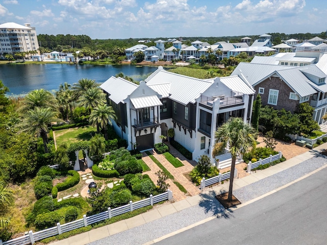 birds eye view of property featuring a water view