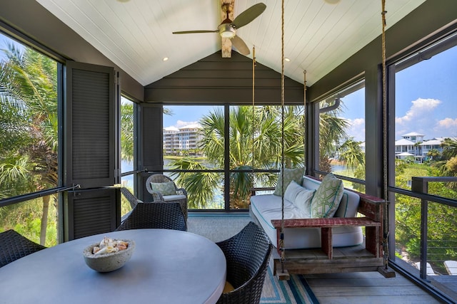 sunroom featuring a wealth of natural light, lofted ceiling, and ceiling fan