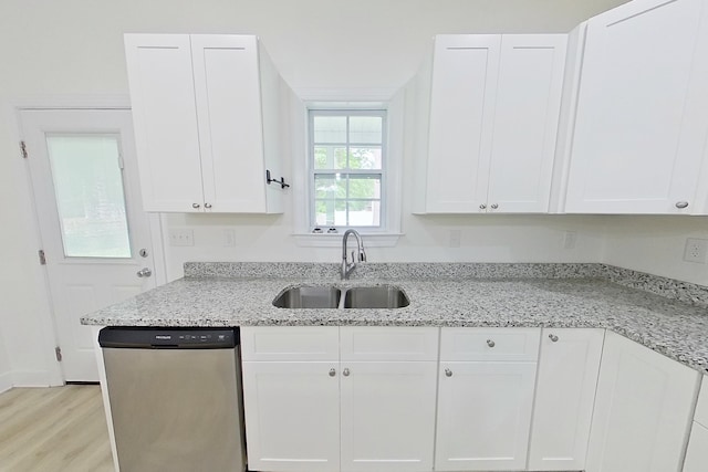 103 Heather Ln, Thomasville, GA 31792 - kitchen with stainless steel dishwasher, a sink, white cabinets, and light wood-type flooring