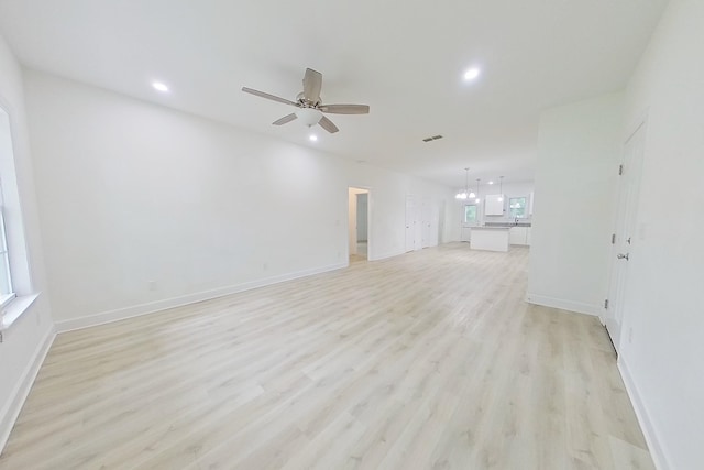 103 Heather Ln, Thomasville, GA 31792 - unfurnished living room with light wood-type flooring, a ceiling fan, recessed lighting, and baseboards