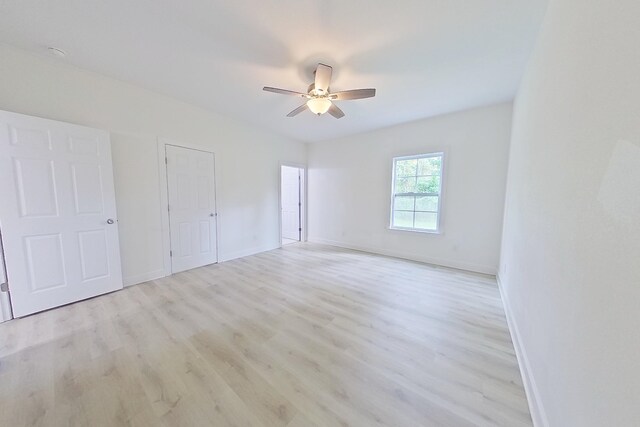 103 Heather Ln, Thomasville, GA 31792 - unfurnished bedroom featuring wood finished floors, baseboards, and ceiling fan
