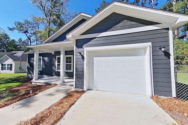 103 Heather Ln, Thomasville, GA 31792 - view of front of home with covered porch, an attached garage, and driveway