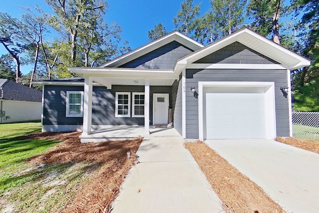 103 Heather Ln, Thomasville, GA 31792 - view of front of home with a porch, a garage, and concrete driveway