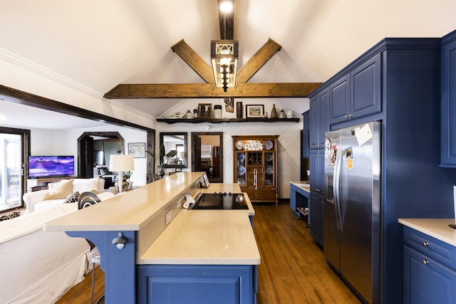kitchen featuring blue cabinetry, a kitchen breakfast bar, open floor plan, and stainless steel fridge with ice dispenser