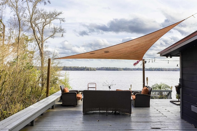 wooden deck with a water view