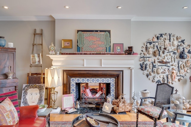 living area featuring visible vents, recessed lighting, and ornamental molding