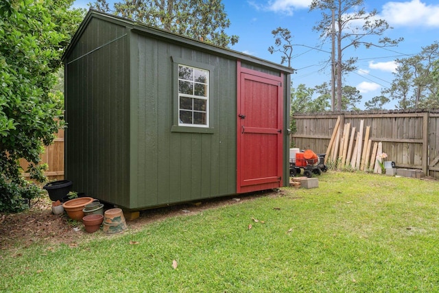 view of shed with fence