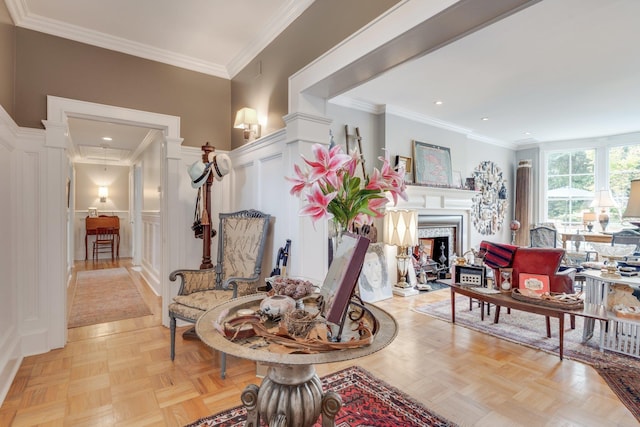 interior space featuring crown molding, recessed lighting, a decorative wall, and a fireplace