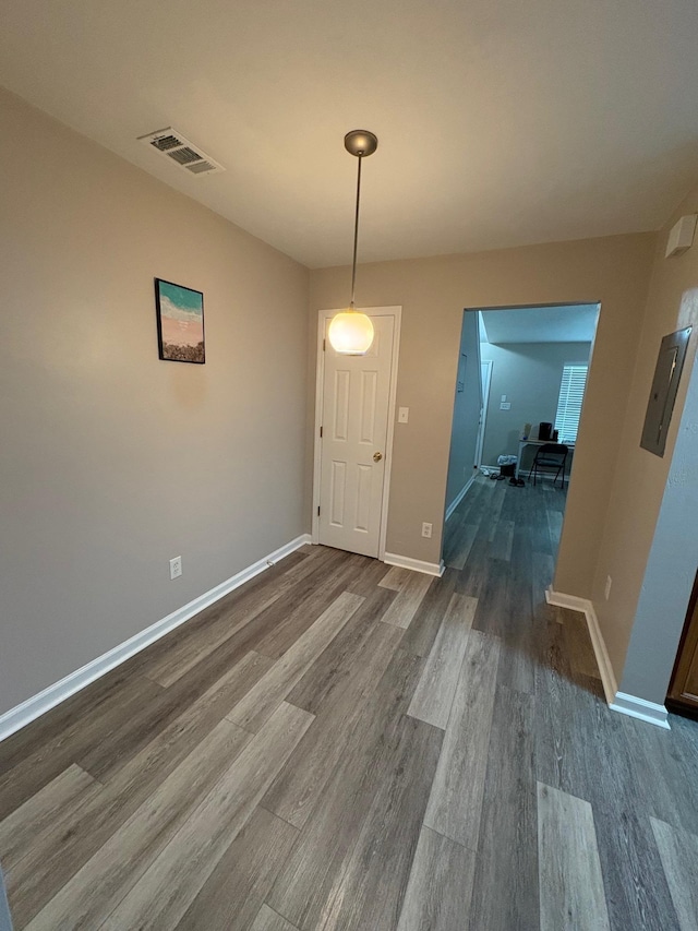 2525 Hartsfield Rd Unit 9, Tallahassee, FL 32303 - unfurnished dining area with dark wood-style floors and baseboards
