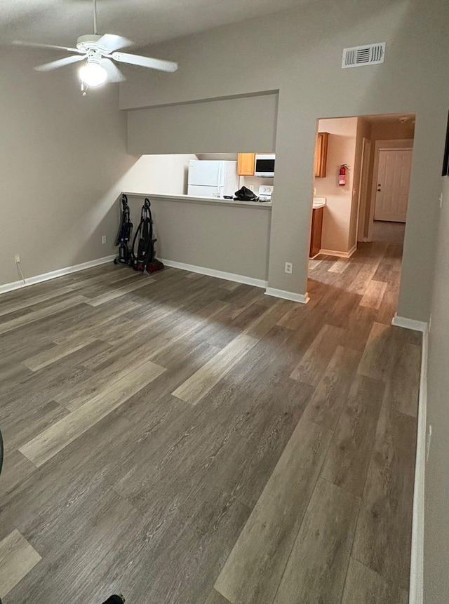 2525 Hartsfield Rd Unit 9, Tallahassee, FL 32303 - unfurnished living room with wood finished floors, ceiling fan, and vaulted ceiling