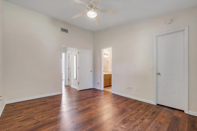 3268 Garcia Dr, Tallahassee, FL 32309 - unfurnished bedroom featuring wood finished floors, baseboards, and ensuite bathroom