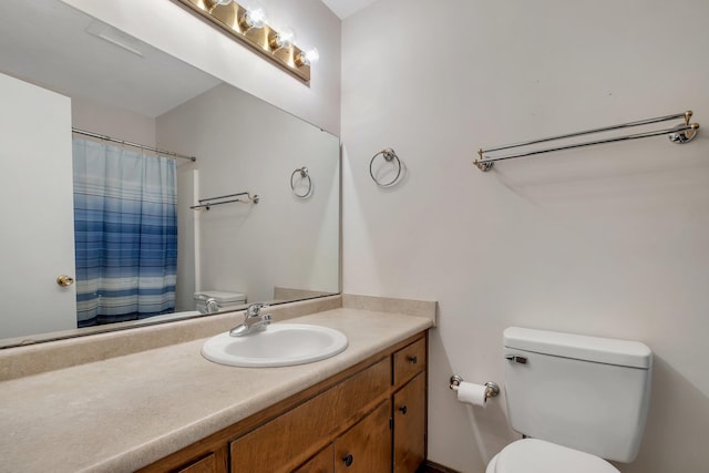 3268 Garcia Dr, Tallahassee, FL 32309 - bathroom featuring toilet, vanity, and a shower with curtain