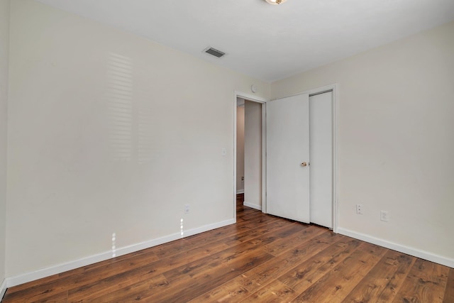 3268 Garcia Dr, Tallahassee, FL 32309 - unfurnished bedroom with wood finished floors, baseboards, and a closet