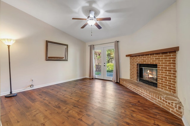 3268 Garcia Dr, Tallahassee, FL 32309 - unfurnished living room featuring a ceiling fan, vaulted ceiling, wood finished floors, baseboards, and a brick fireplace