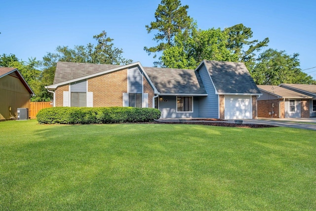 3268 Garcia Dr, Tallahassee, FL 32309 - view of front of property featuring brick siding, a garage, cooling unit, driveway, and a shingled roof