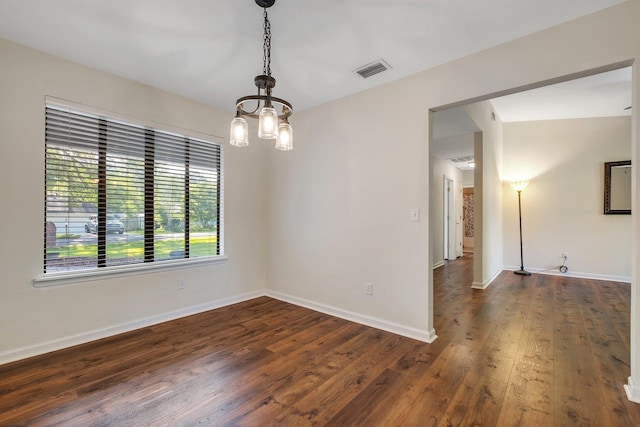3268 Garcia Dr, Tallahassee, FL 32309 - unfurnished room with a chandelier, dark wood finished floors, and baseboards