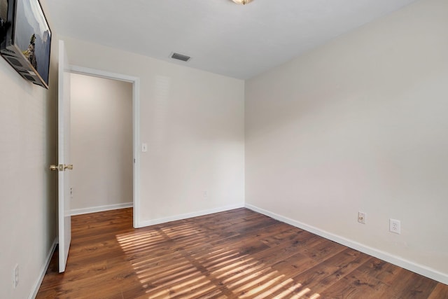 3268 Garcia Dr, Tallahassee, FL 32309 - spare room with wood finished floors and baseboards