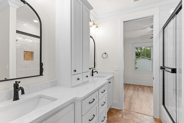 3235 Magazine Cir, Tallahassee, FL 32312 - bathroom with crown molding, a shower with door, double vanity, and baseboards