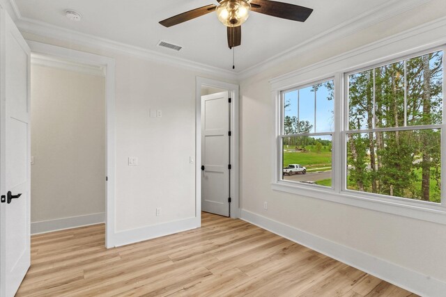 3235 Magazine Cir, Tallahassee, FL 32312 - unfurnished bedroom featuring baseboards, multiple windows, light wood-style flooring, ornamental molding, and a ceiling fan