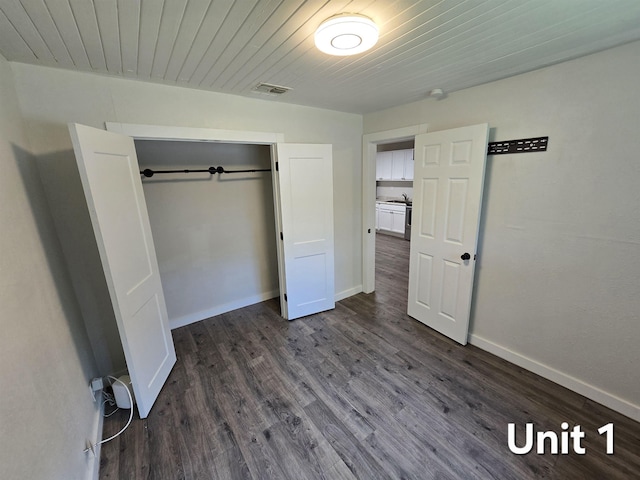 208 Putnam Dr Unit 1, 2, 3, Tallahassee, FL 32301 - unfurnished bedroom with dark wood-style flooring and a closet