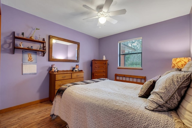 bedroom with ceiling fan and light hardwood / wood-style flooring