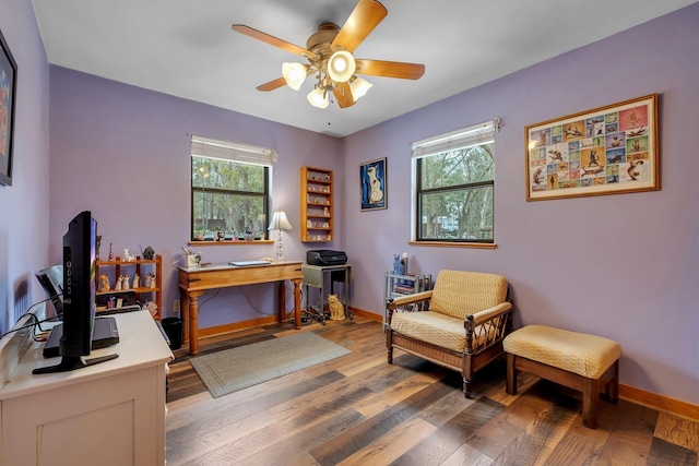 home office featuring hardwood / wood-style flooring, ceiling fan, and plenty of natural light