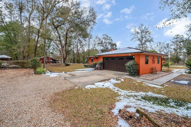 view of side of home featuring a garage