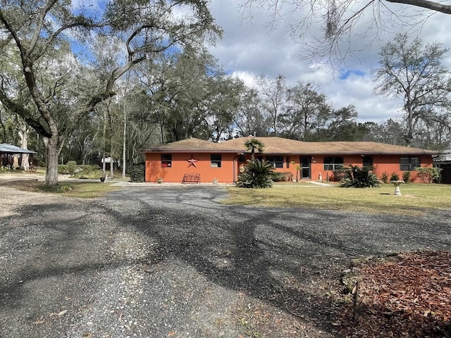 376 Tecumseh Rd, Monticello, FL 32344 - ranch-style home with driveway and a front lawn