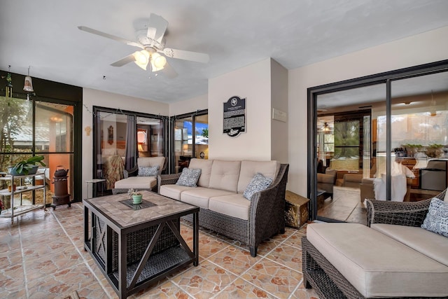 376 Tecumseh Rd, Monticello, FL 32344 - living room featuring ceiling fan and stone finish floor