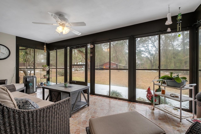 sunroom featuring plenty of natural light and ceiling fan