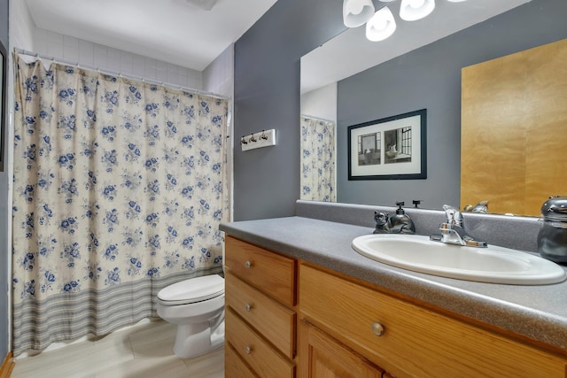 full bathroom with vanity, toilet, and shower / tub combo with curtain